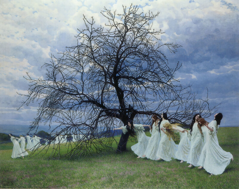 Women dancing around a bare tree