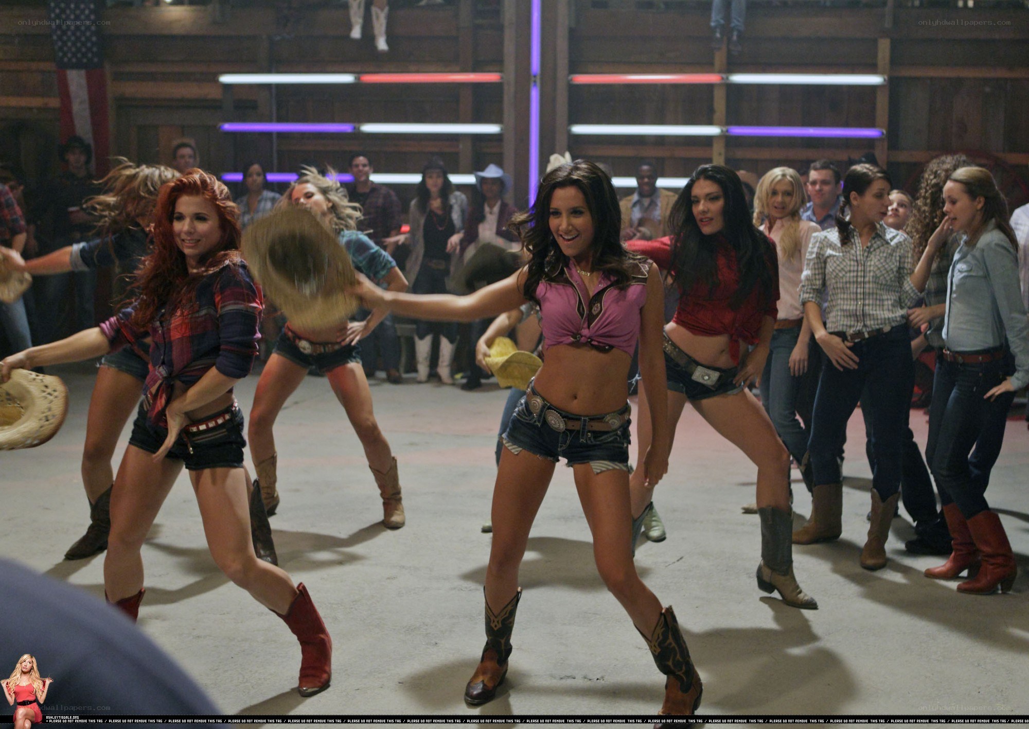 Women dancing in a barn