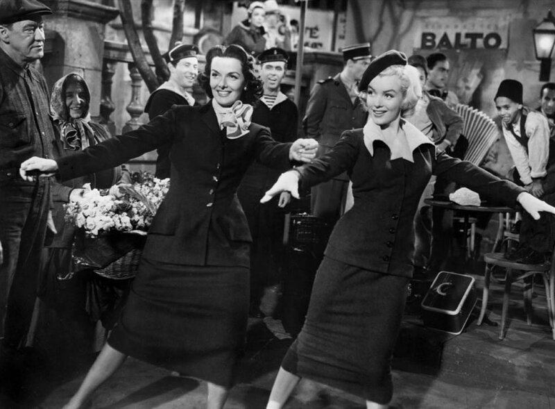 Women dancing in a street scene