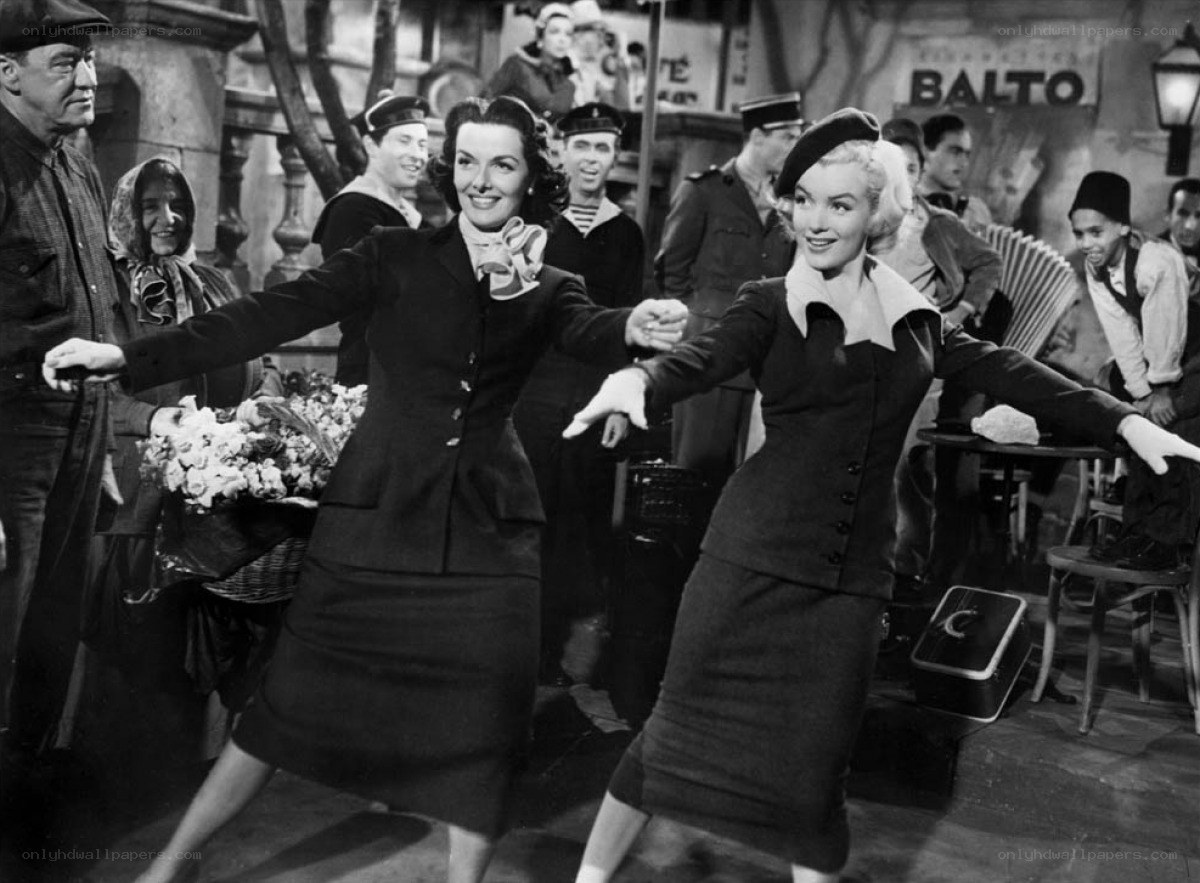 Women dancing in a street scene