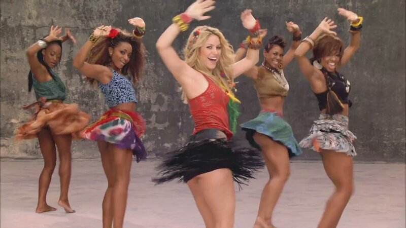 women dancing in colorful outfits