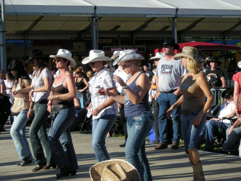 Women Dancing in Cowboy Hats