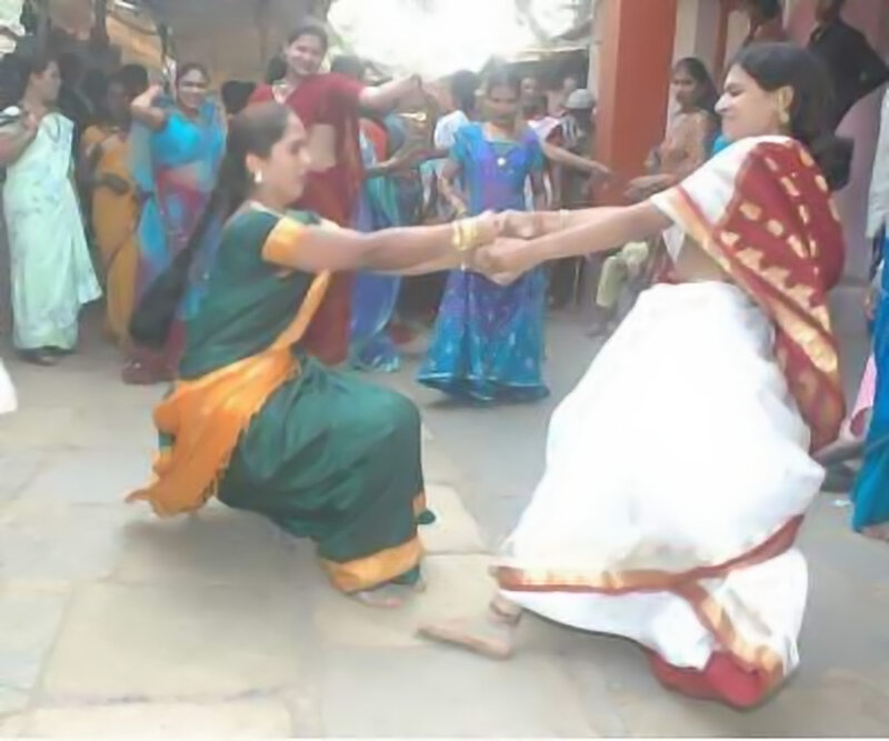 Women dancing in traditional attire