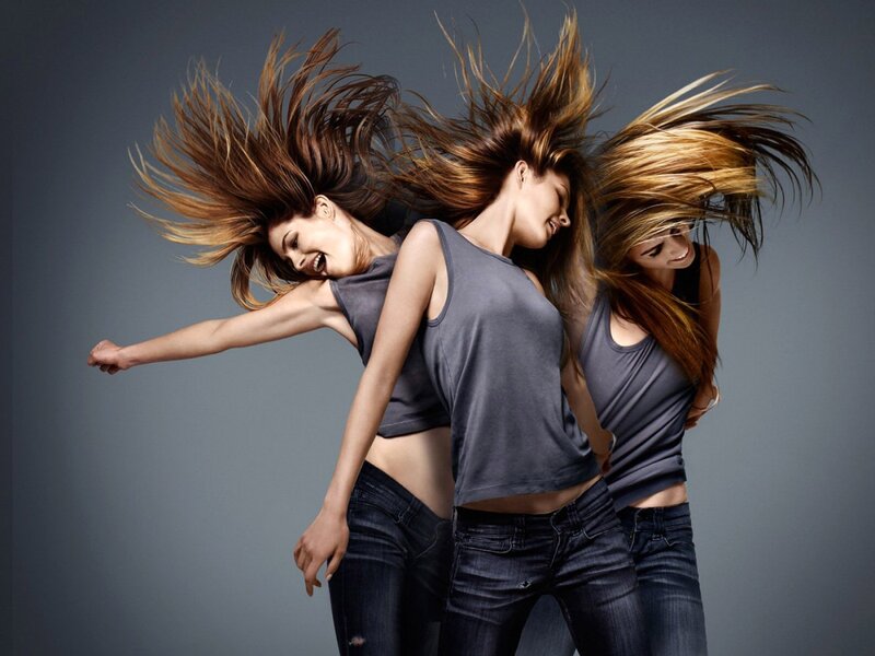 Women dancing with hair flying