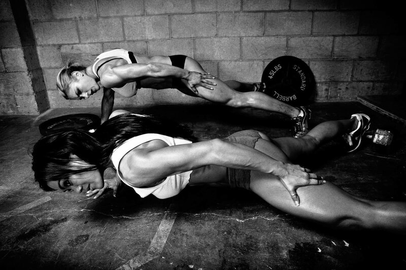 Women doing push-ups in gym