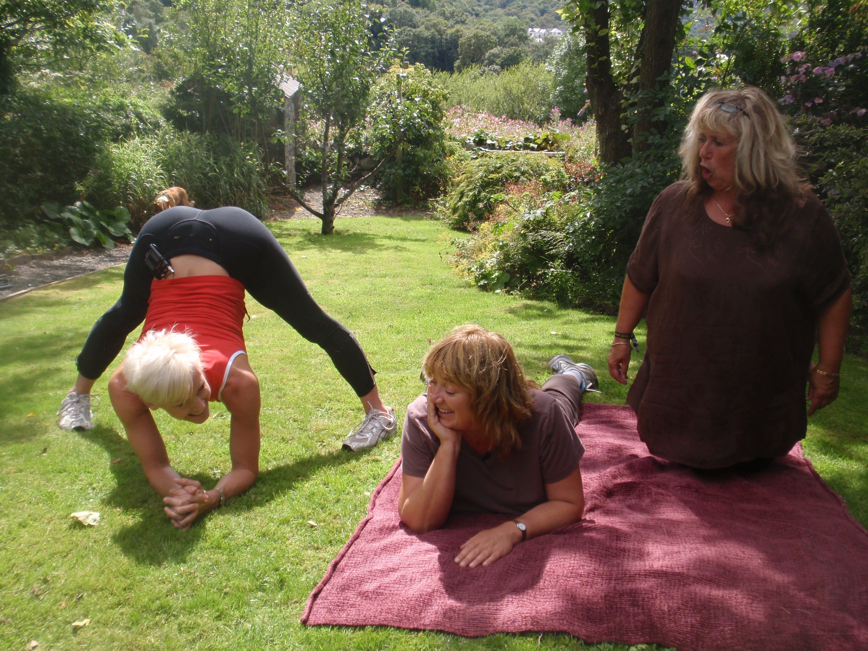 Women exercising in a garden