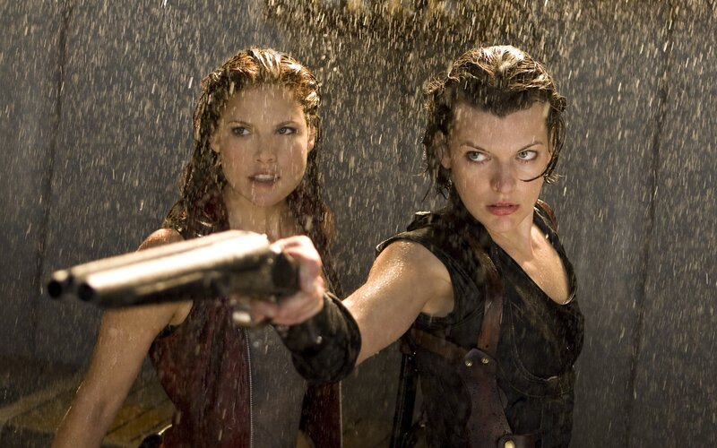 women holding guns in rain