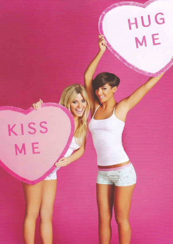 Women holding heart signs