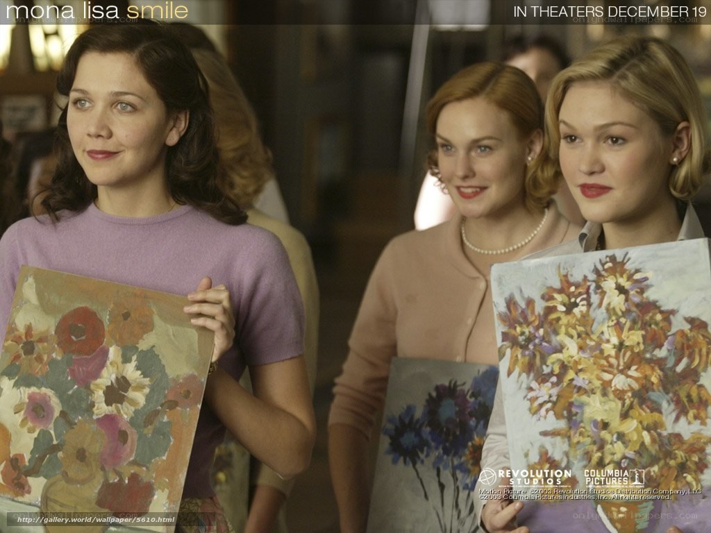 women holding paintings