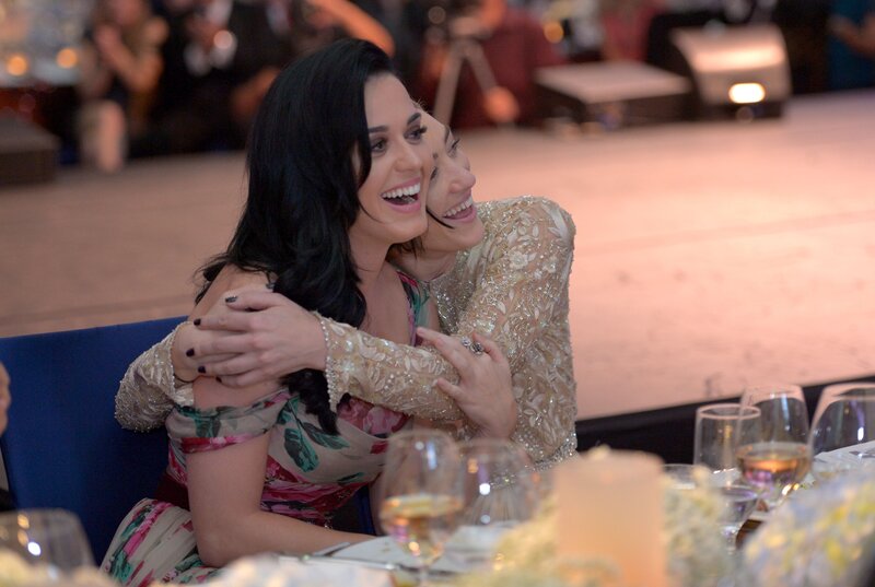 Women hugging at a formal event