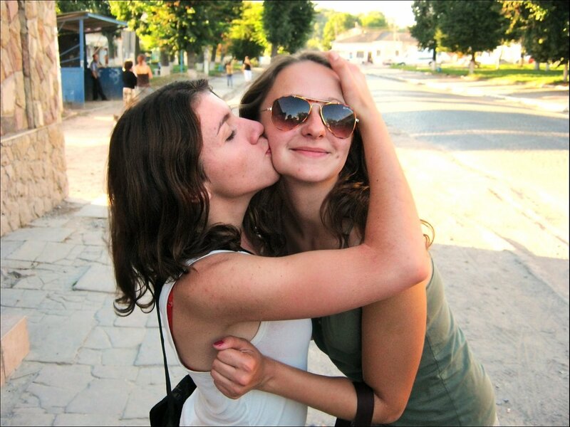 Women hugging on a street