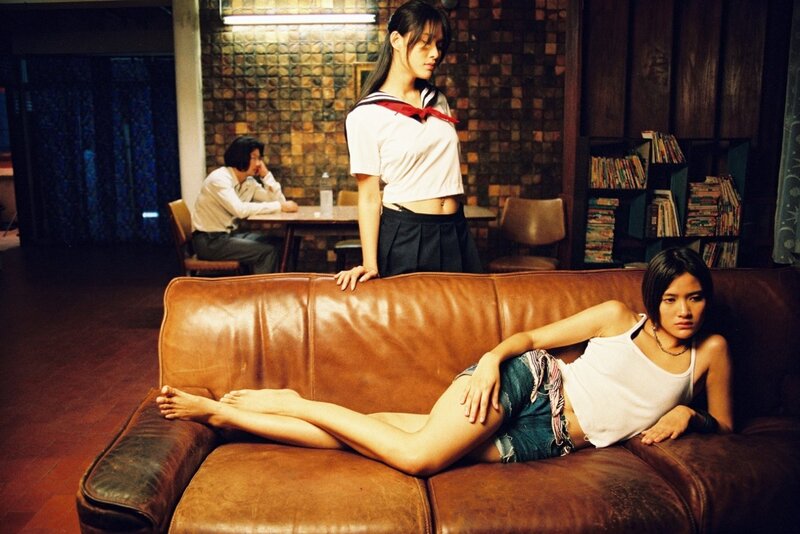 Women in a dimly lit room