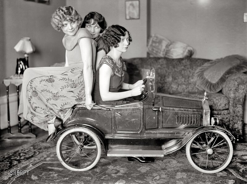 Women in a toy car