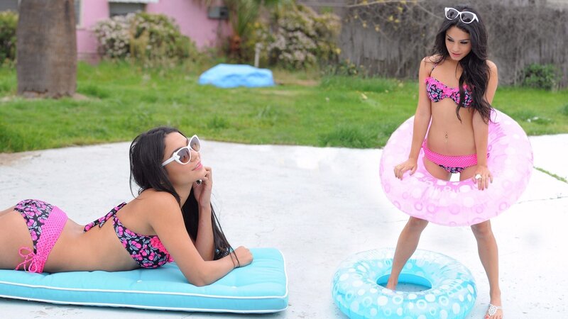 Women in bikinis with floaties