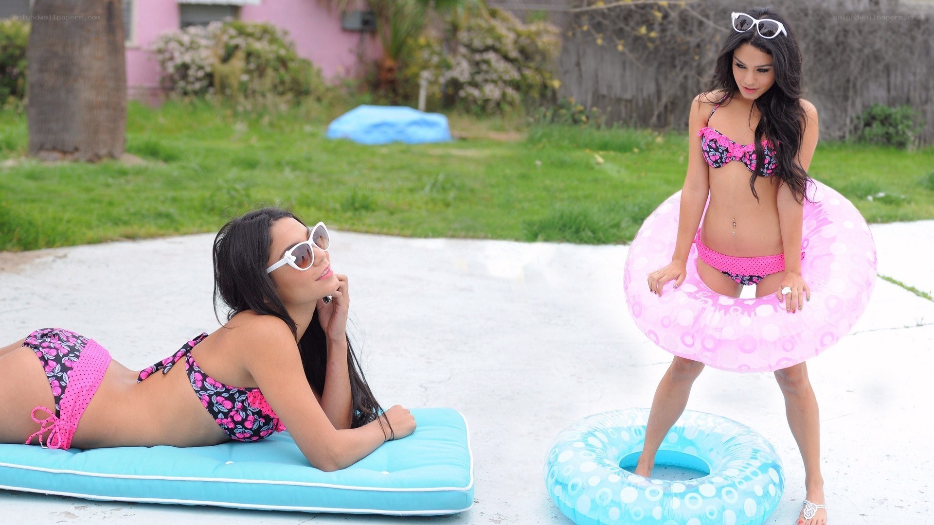 Women in bikinis with floaties