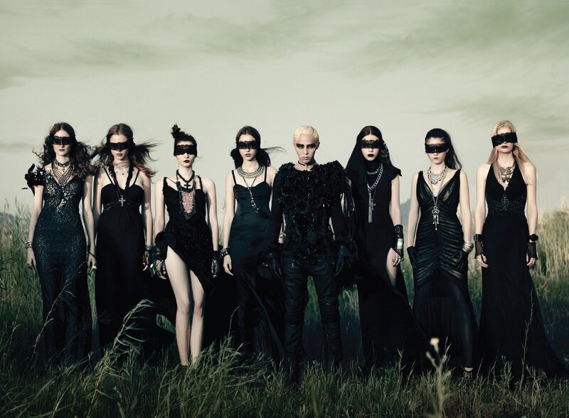 Women in black masks and dresses