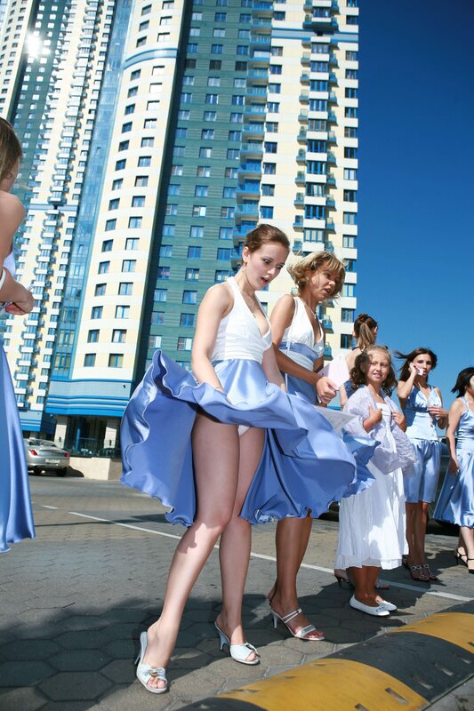 Women in blue dresses outdoors