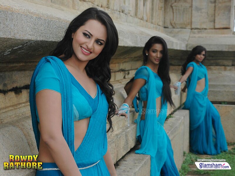Women in blue sarees at temple