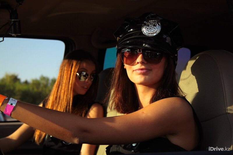 Women in car wearing police hats