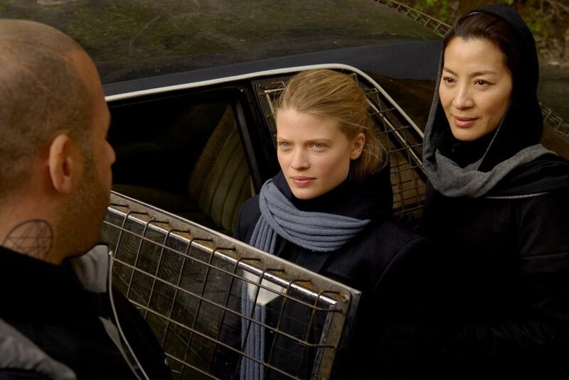 Women in car with man