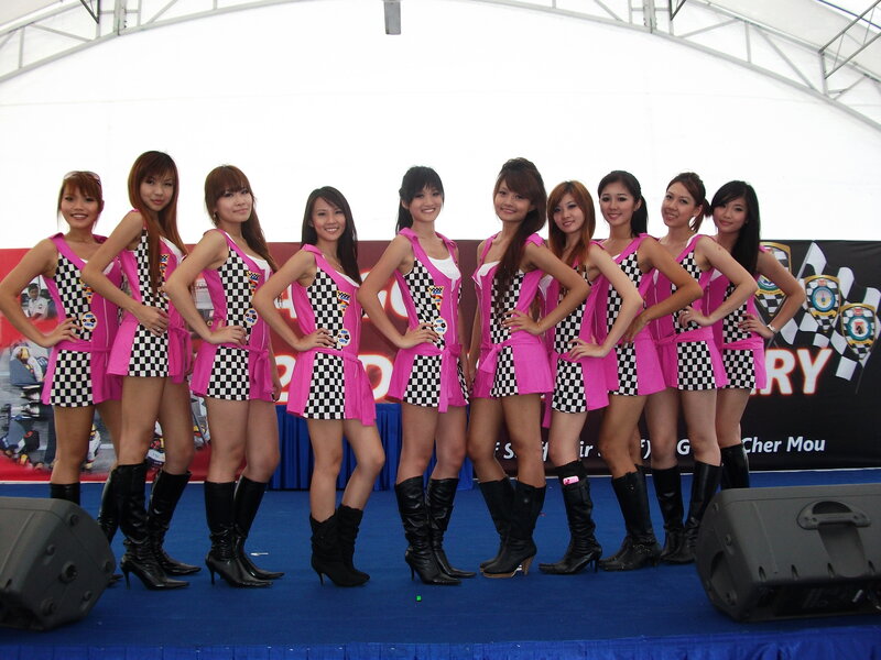 Women in checkered outfits on stage