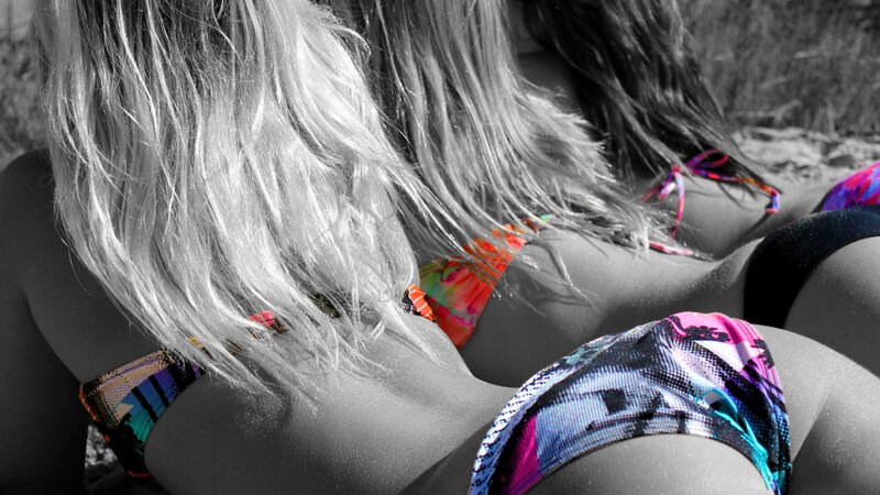 women in colorful bikinis