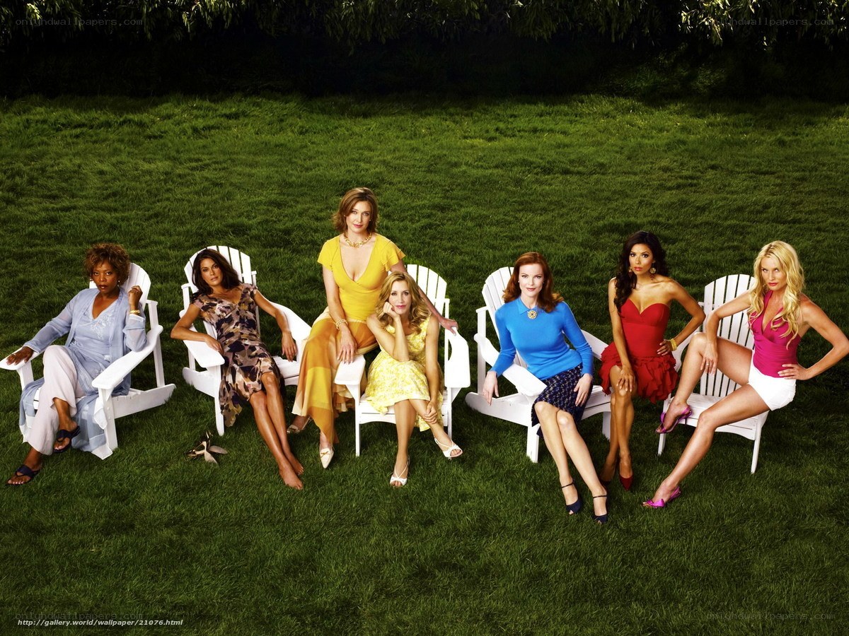 women in colorful dresses on lawn
