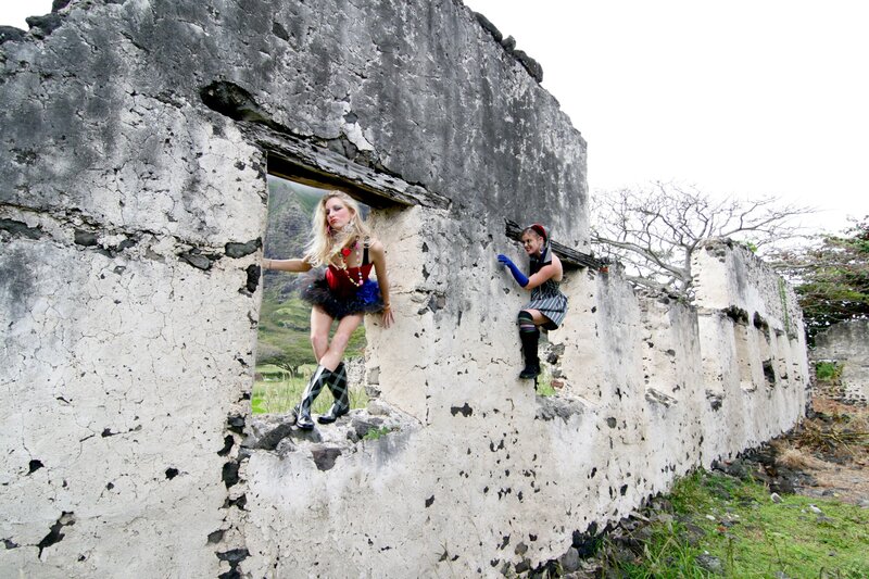 Women in costumes on ruins