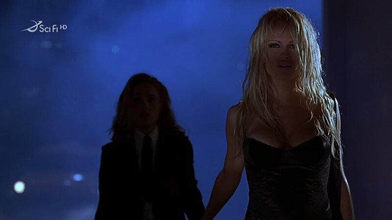 women in dark room scene