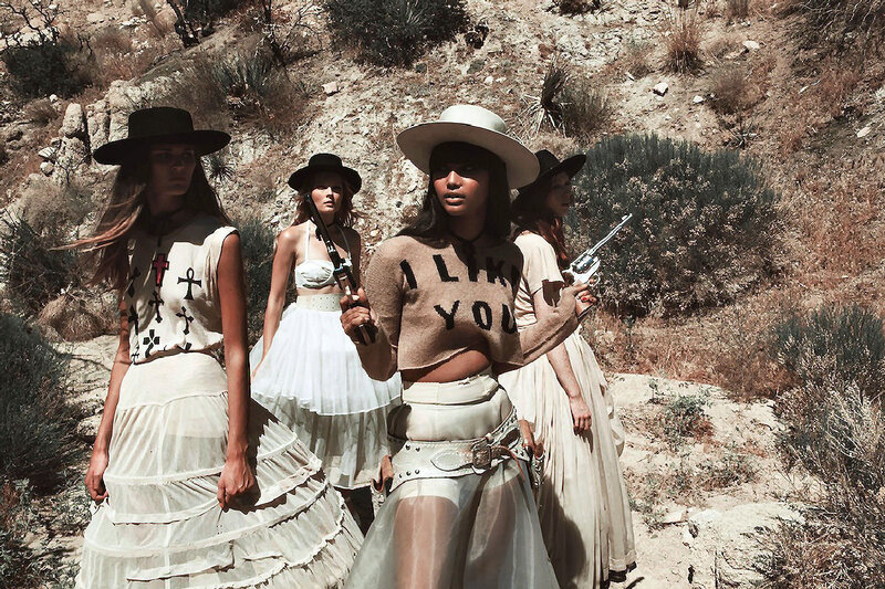 Women in Desert with Guns