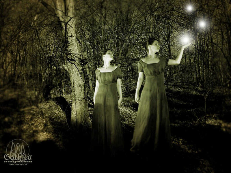 Women in forest with glowing orbs