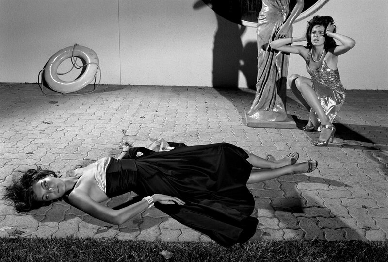 Women in formal wear on pavement