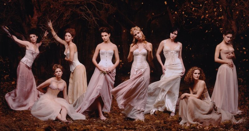 Women in gowns in a forest