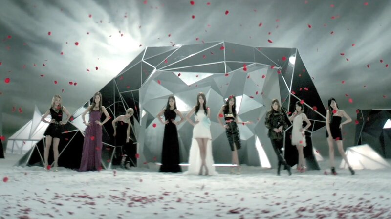 women in gowns with rose petals
