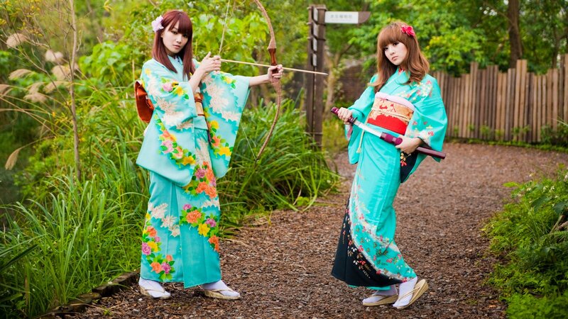 Women in kimonos with weapons