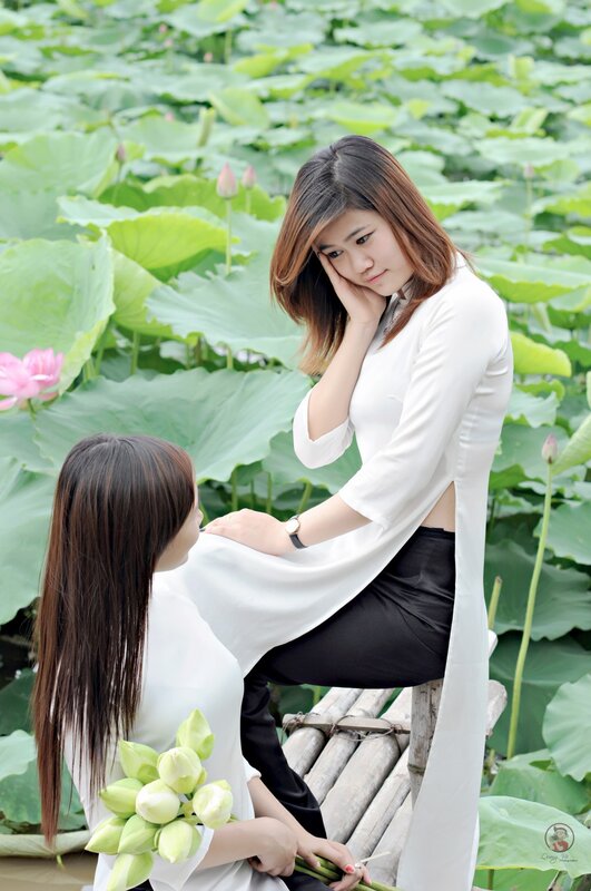 Women in lotus pond