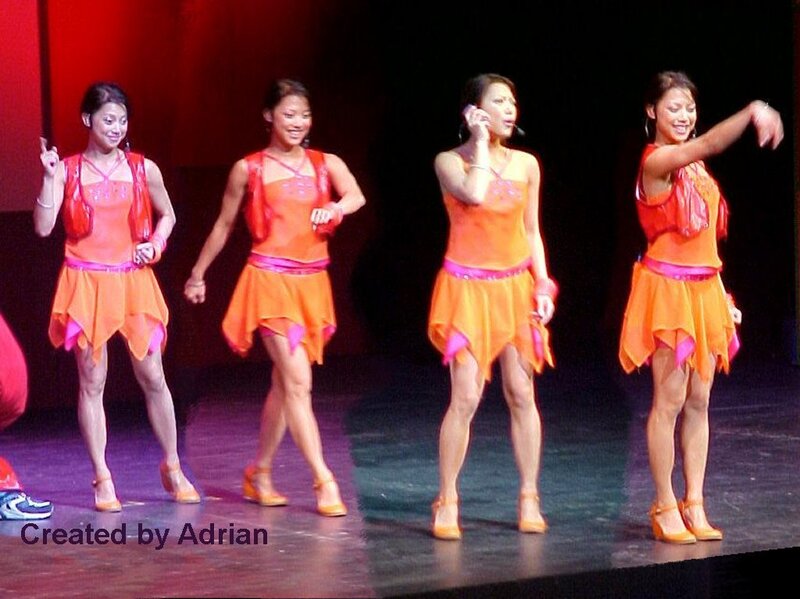Women in Orange Costumes