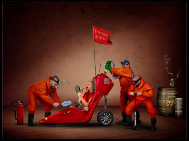 Women in red car with workers