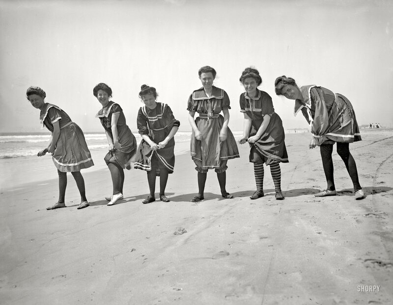 Women in sailor dresses on a beach