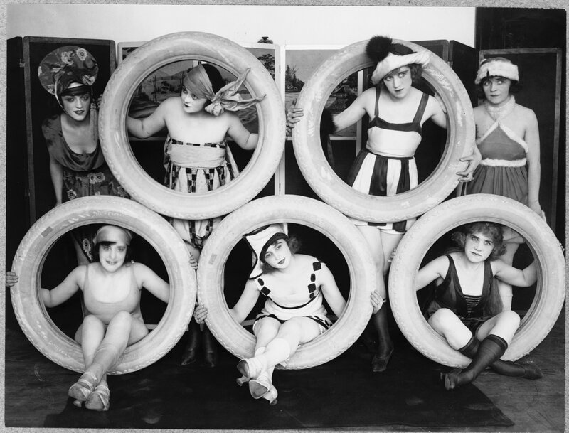 Women in tires with costumes