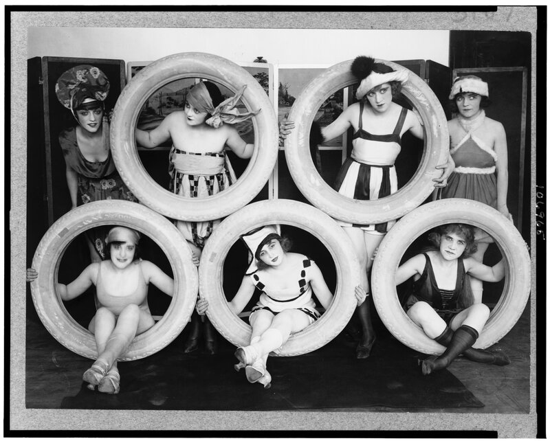 Women in tires with costumes