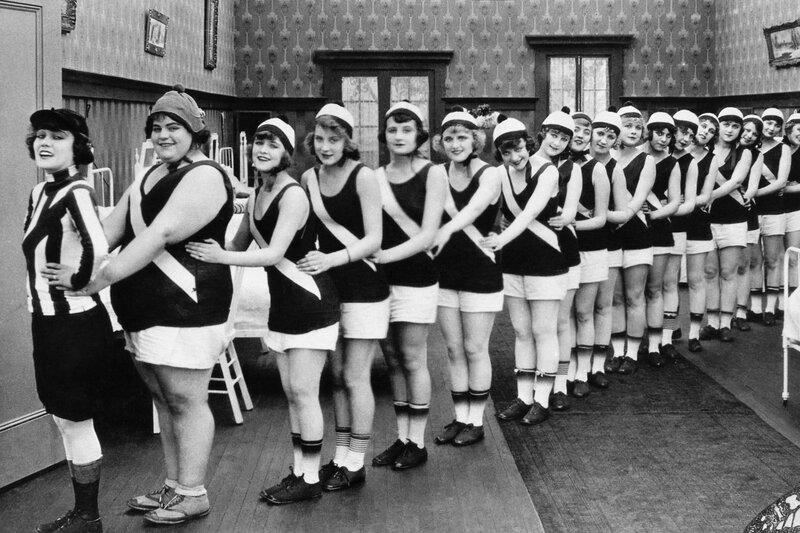 Women in vintage athletic uniforms