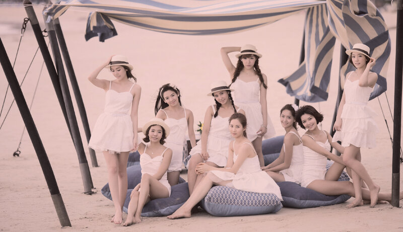 women in white dresses on beach