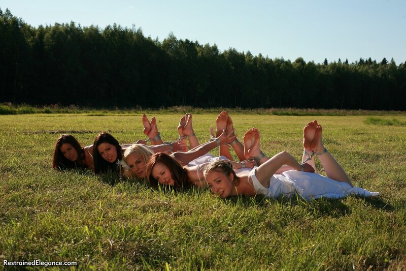 Women in white dresses on grass
