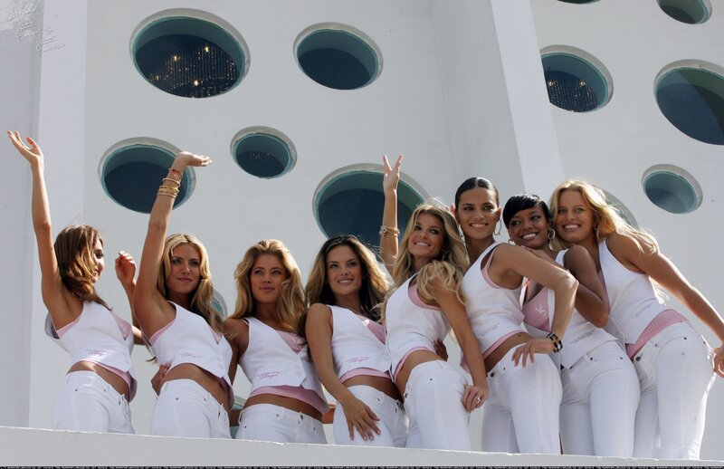 Women in white on a balcony