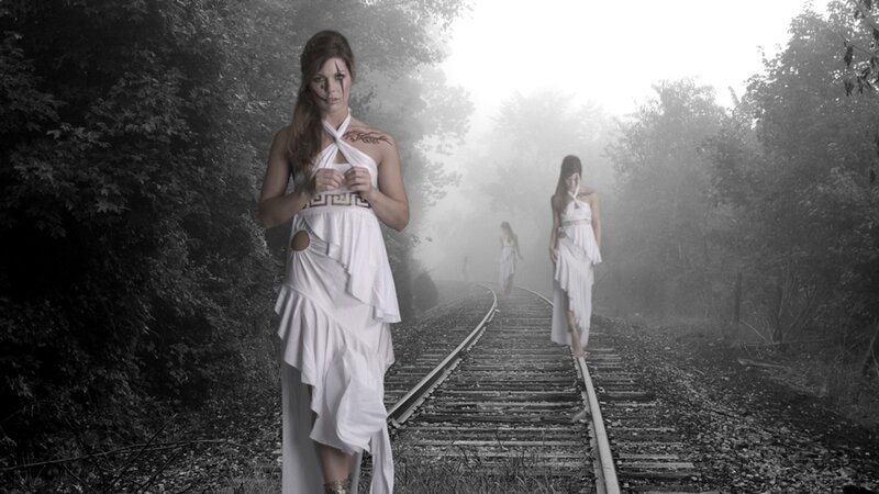 Women in white on train tracks