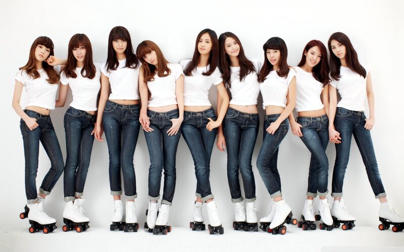 women in white t-shirts and jeans