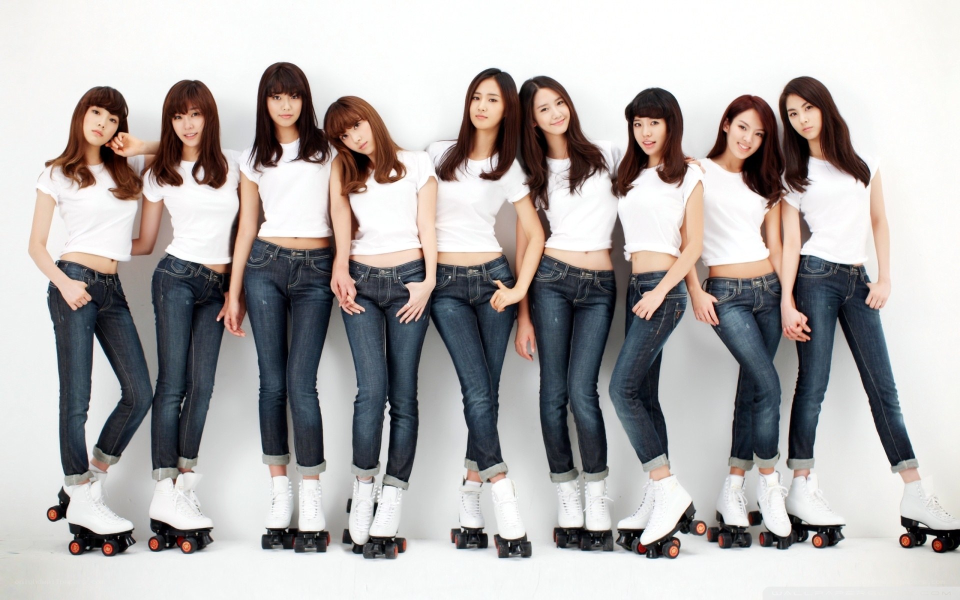 women in white t-shirts and jeans