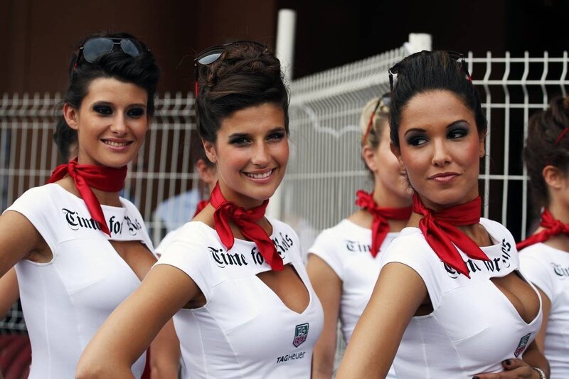 Women in white uniforms with red scarves