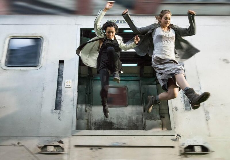 Women jumping from a moving train